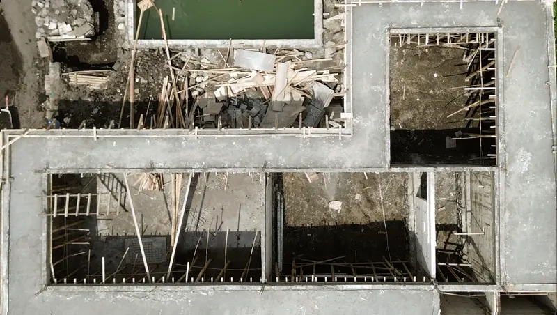 An aerial view of a foundation and ground floor walls on site